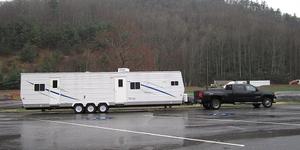 Trailer being moved by professional transport equipment